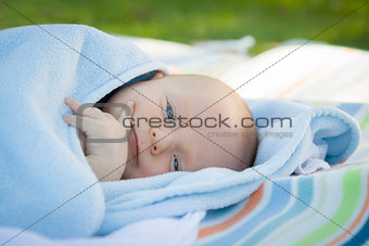 Little Baby Boy Resting in His Warm Blanket
