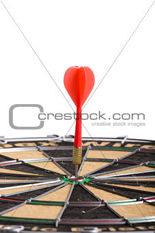 Red Dart hitting the middle of dartboard