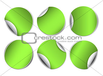 Set of green round promotional stickers.