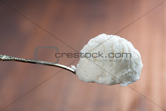 Vanilla ice cream on spoon