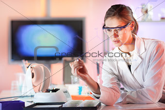 Life science researcher working in laboratory.