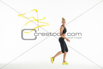 Rhythmic gymnast doing exercise with a ribbon