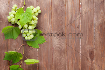 Bunch of white grapes with leaves