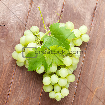 Bunch of grapes on wooden table