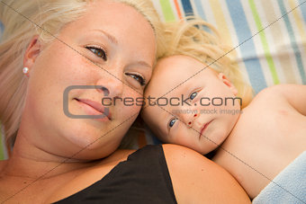 Cute Baby Boy Laying Next to His Mommy on Blanket