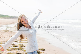 Young woman happy on beach