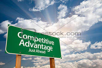Competitive Advantage Green Road Sign Over Clouds