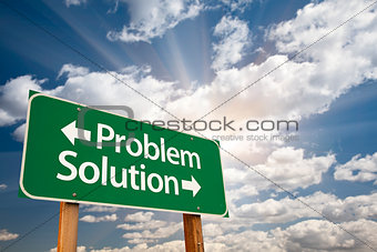 Problem and Solution Green Road Sign Over Clouds