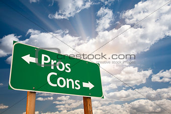 Pros and Cons Green Road Sign Over Clouds