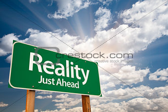 Reality Green Road Sign Over Clouds