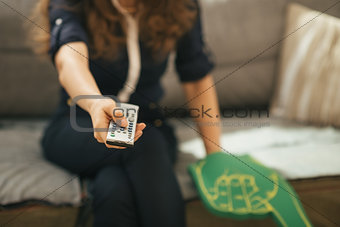 Closeup on football fan woman sitting on couch and watching tv