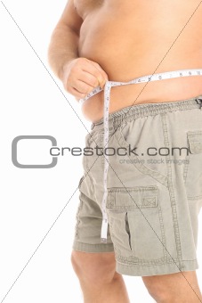 shot of a man measuring waist