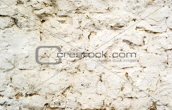 Background of old cracked painted stone wall with cement