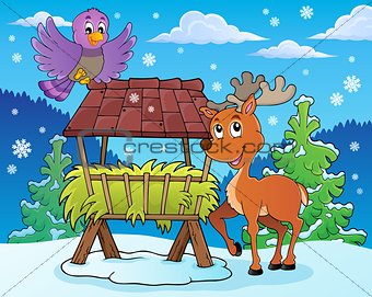 Hay rack with reindeer and bird