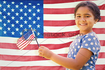 Composite image of cute girl with american flag