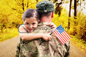 Composite image of soldier reunited with his daughter