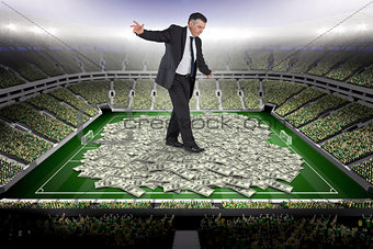 Composite image of mature businessman doing a balancing act