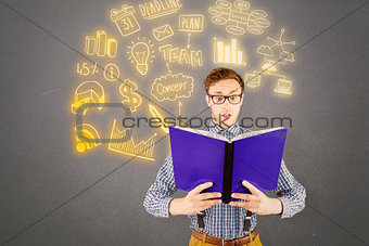 Composite image of geeky businessman reading a book