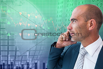 Composite image of businessman calling on the phone