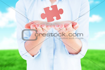 Composite image of womans hands presenting