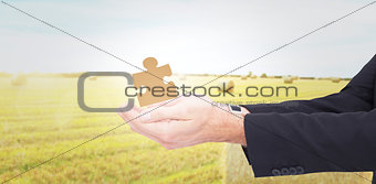 Composite image of businessman with arms out presenting something