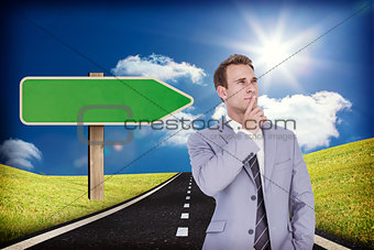 Composite image of thinking businessman