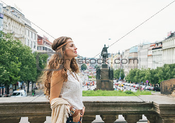 Hippy-looking woman tourist enjoying sightseeing in Prague