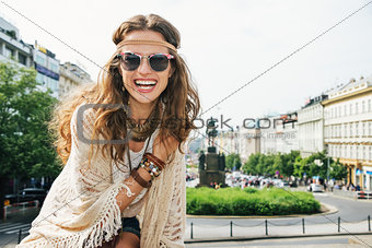 Portrait of smiling young woman wearing boho clothes in Prague
