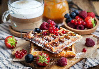 Belgian waffles with fresh berries and cappuccino 