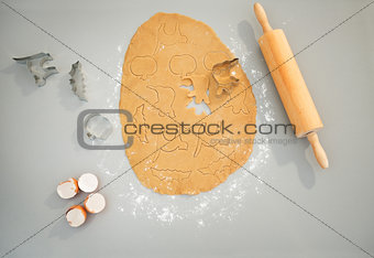 Closeup on shapes of cut out Halloween biscuits on table.
