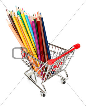 Crayons in shopping cart on white