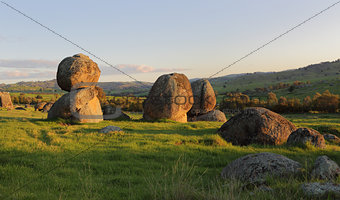 Balancing stones across the landscape