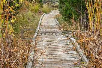 old twisted wooden boardwalk 