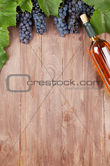 Red grape and wine bottle
