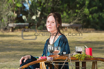 Pagan Woman Sitting Outdoors