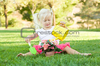 Little Girl Playing Gardener with Her Tools and Flower Pot