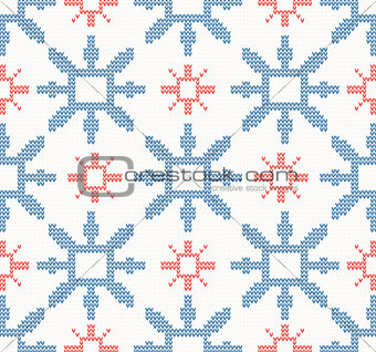 Christmas knitted seamless pattern with blue and red snowflakes