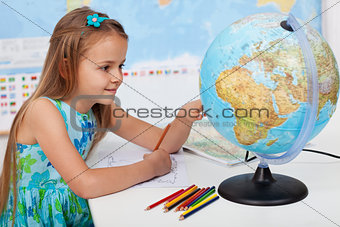 Young girl in geography class