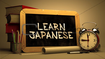 Learn JapaneseHandwritten by white Chalk on a Blackboard.