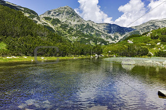Reflection of Muratov peak in Mountain river, Pirin Mountain