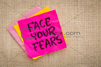 Face your fears advice on sticky note