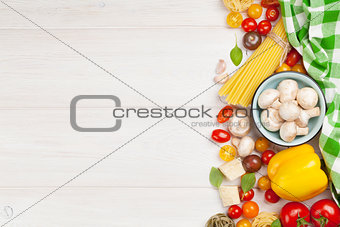 Italian food cooking ingredients. Pasta, vegetables, spices
