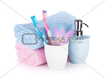 Toothbrushes, soap, two towels and flower