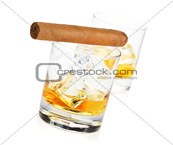 Two whiskey glasses and cigar