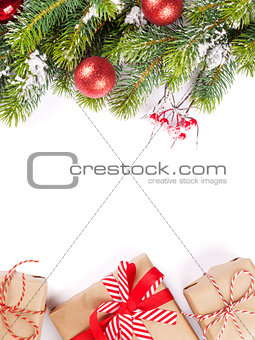 Christmas tree branch with gift boxes