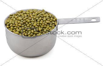 Green mung beans in a measuring cup