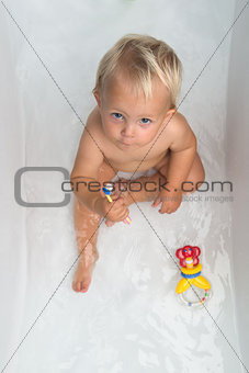 Baby girl is having a bath