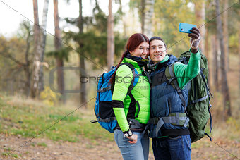 woman and man taking selfie