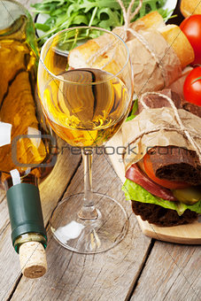White wine glass and sandwiches