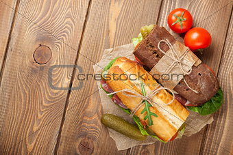 Two sandwiches with salad, ham, cheese